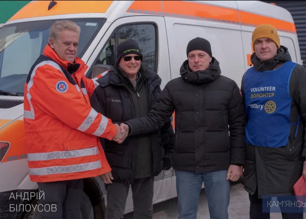 Marco Katz, Dnipro Rotary Club President, shaking hands with the Mayor of Kamianske